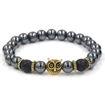 Black beaded bracelet with gold owl's head