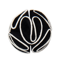 Black and white felt lapel flower