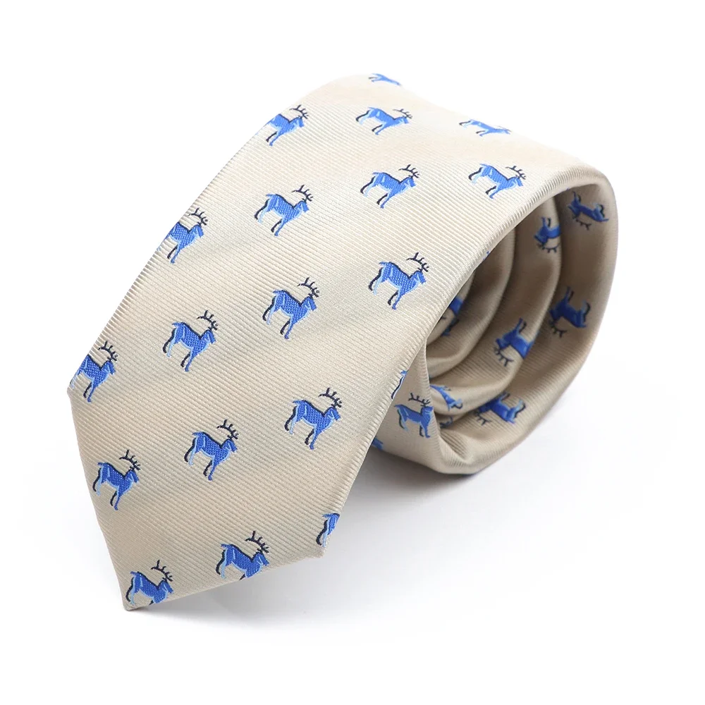 Cream polyester tie w/ blue reindeer 