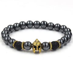 Black beaded bracelet with gold helmet