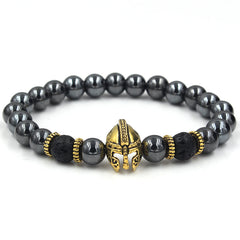 Black beaded bracelet with gold helmet