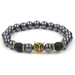 Black beaded bracelet with gold owl's head